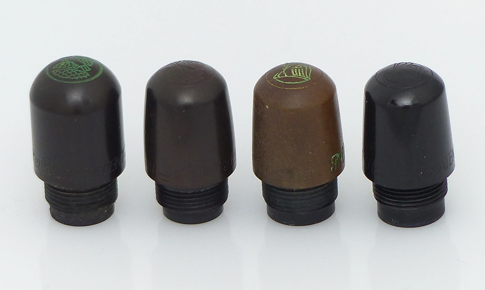 Cylindrical cap head with old logo, conical with old logo, with new logo and injection molding with new logo. Cylindrical cap head with old logo, conical with old logo, with new logo and injection molding with new logo.